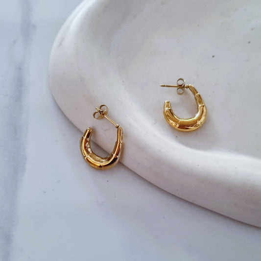 Gold open earrings