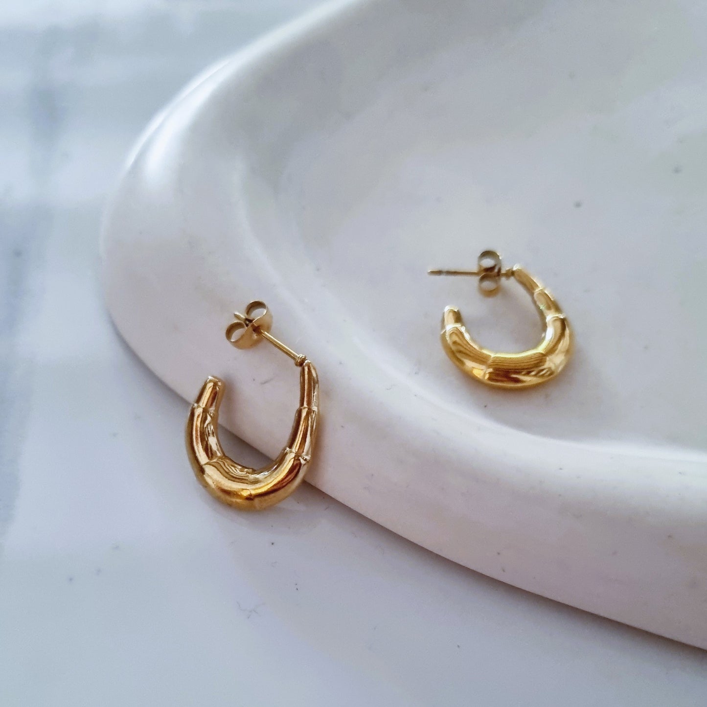 Gold open earrings