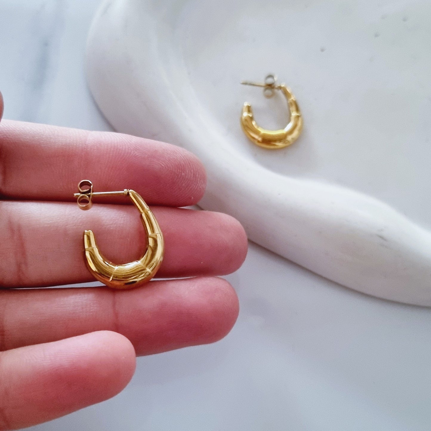 Gold open earrings