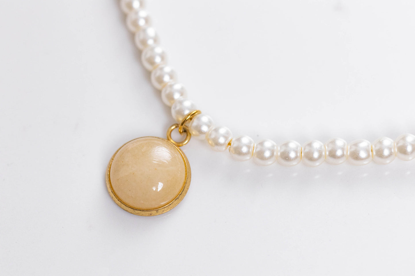 Pearls and precious stones pendant