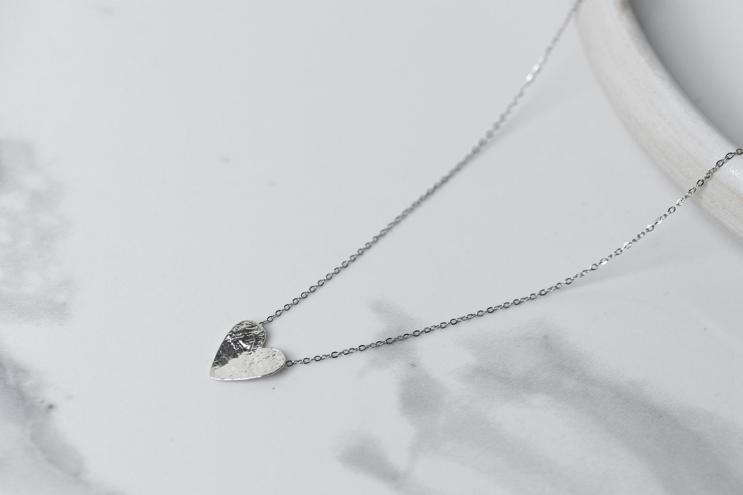 Silver semi-flip heart necklace